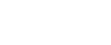 Ein Bild von drei Spielkarten auf einem grünen Filztisch in einem Casino. Die Karten zeigen ein Herz, einen Pik und ein Karo Symbol.